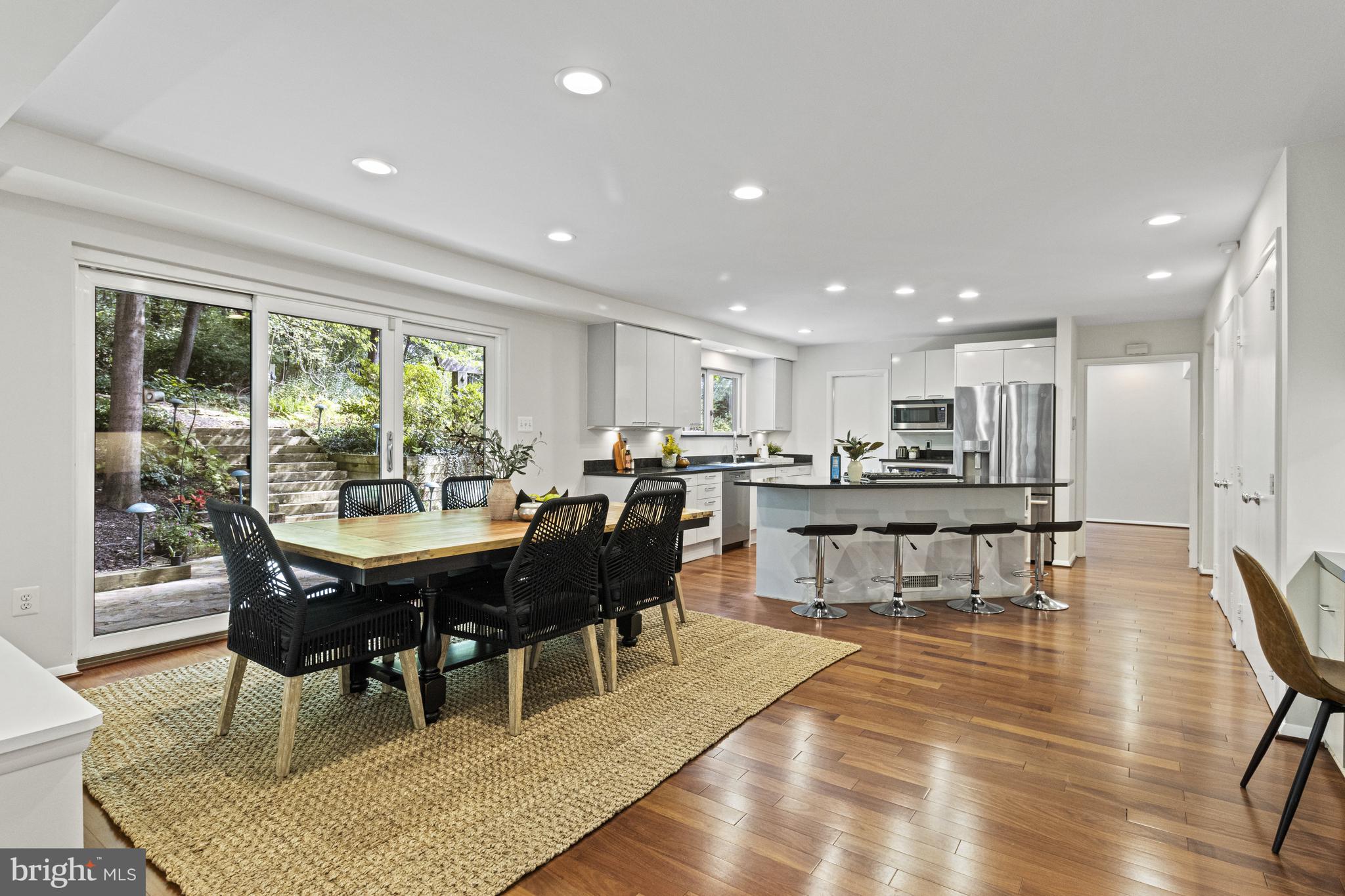 7107 Roxann Road Alexandria, VA 22315 - Photo 14 of 62 a view of a dining room with furniture window and wooden floor