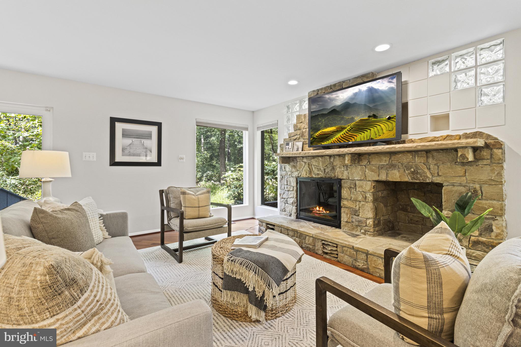 7107 Roxann Road Alexandria, VA 22315 - Photo 17 of 62 a living room with furniture and a fireplace