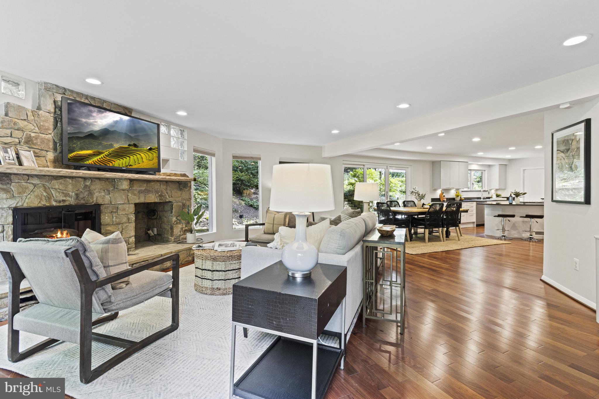 7107 Roxann Road Alexandria, VA 22315 - Photo 19 of 62 a living room with furniture a fireplace and a flat screen tv