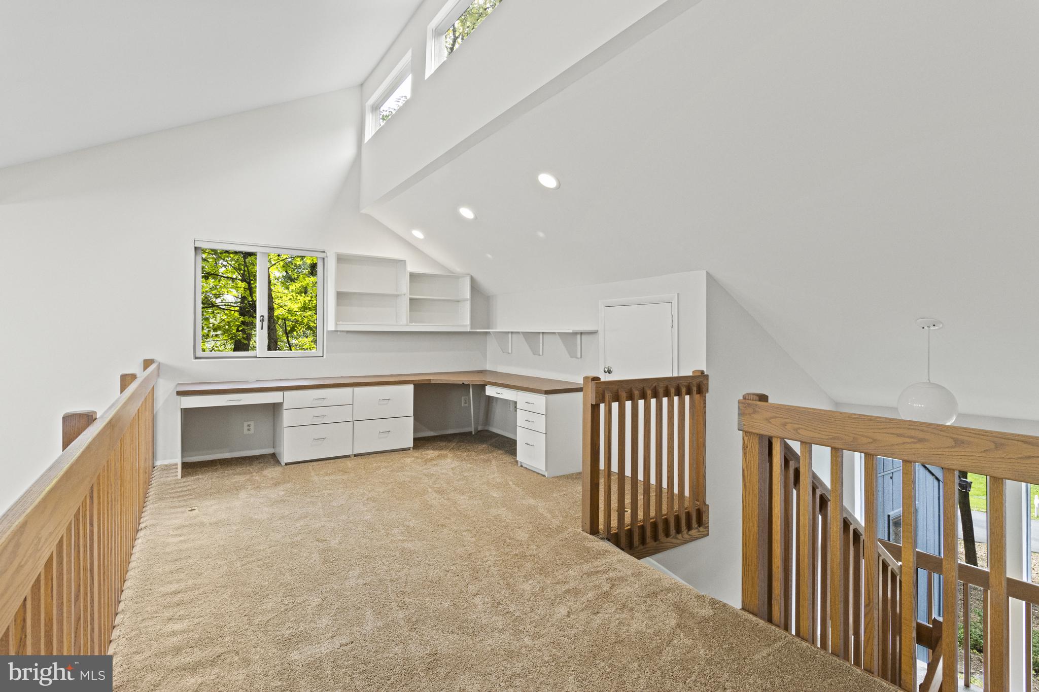 7107 Roxann Road Alexandria, VA 22315 - Photo 22 of 62 a view of a hallway with stairs and furniture