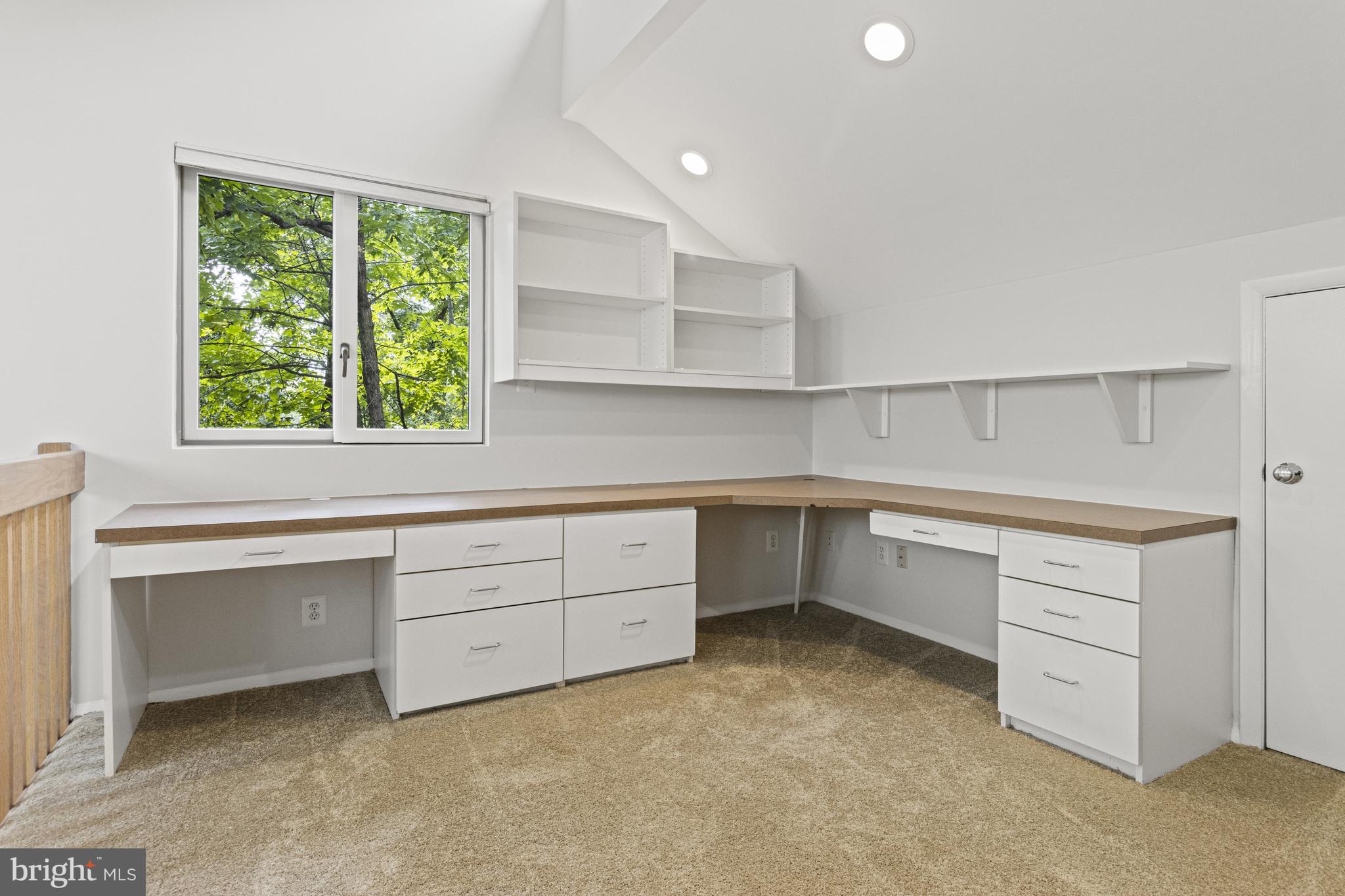 7107 Roxann Road Alexandria, VA 22315 - Photo 23 of 62 a kitchen with white cabinets and window