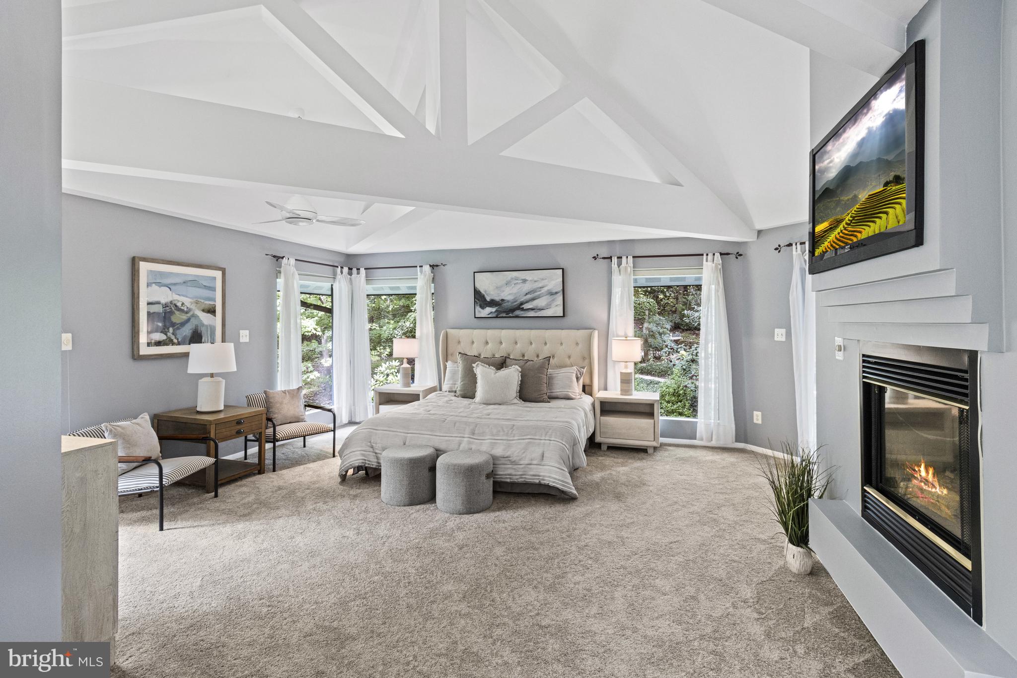 7107 Roxann Road Alexandria, VA 22315 - Photo 25 of 62 a living room with furniture large window and fireplace