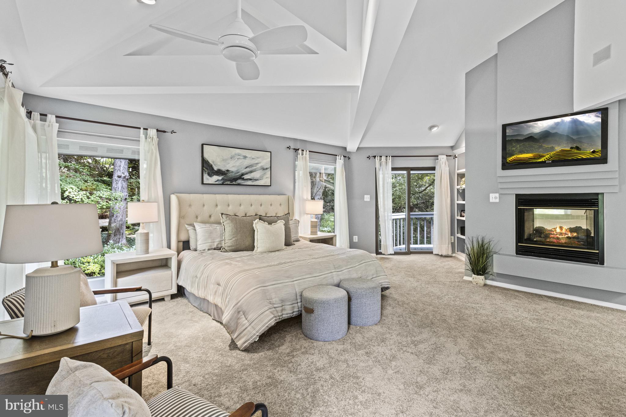 7107 Roxann Road Alexandria, VA 22315 - Photo 27 of 62 a spacious bedroom with a bed and a fireplace