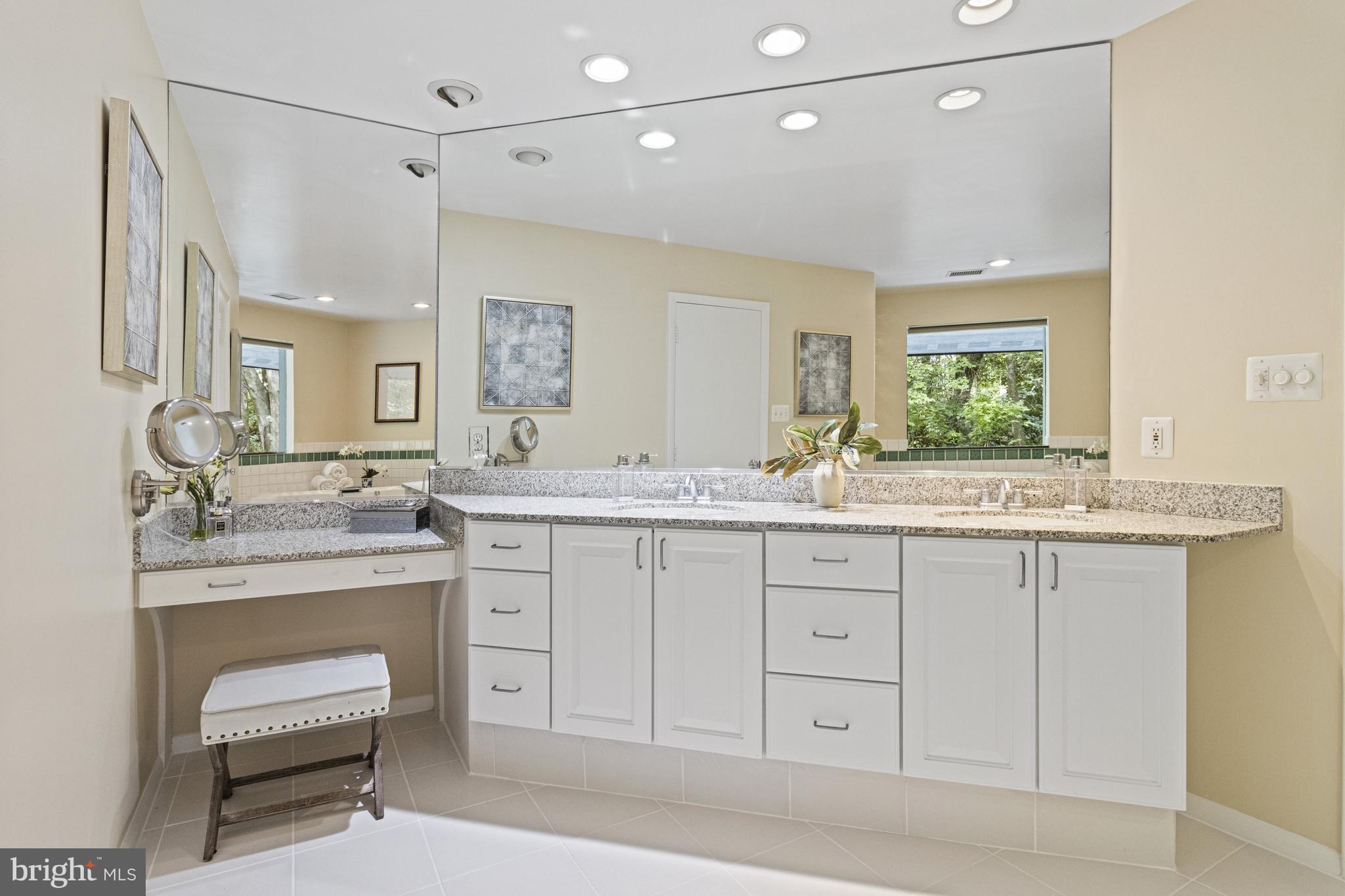 7107 Roxann Road Alexandria, VA 22315 - Photo 29 of 62 a bathroom with a granite countertop sink mirror and a