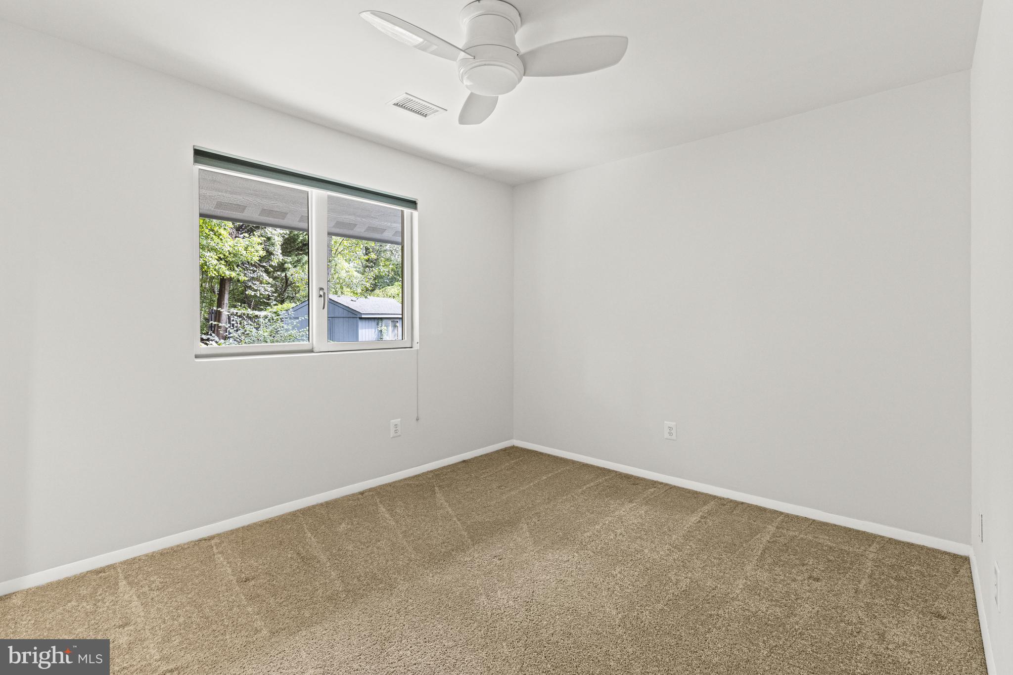 7107 Roxann Road Alexandria, VA 22315 - Photo 32 of 62 an empty room with windows