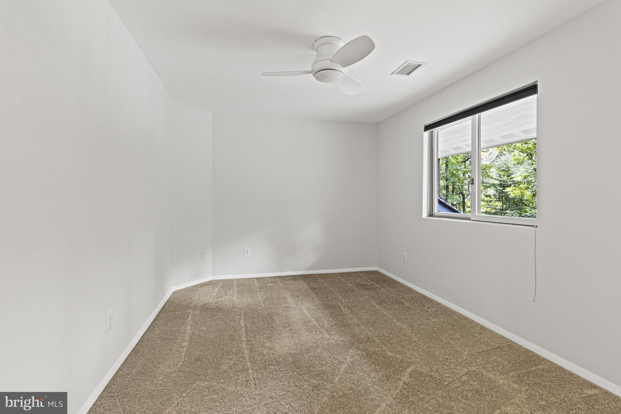 7107 Roxann Road Alexandria, VA 22315 - Photo 36 of 62 an empty room with a window