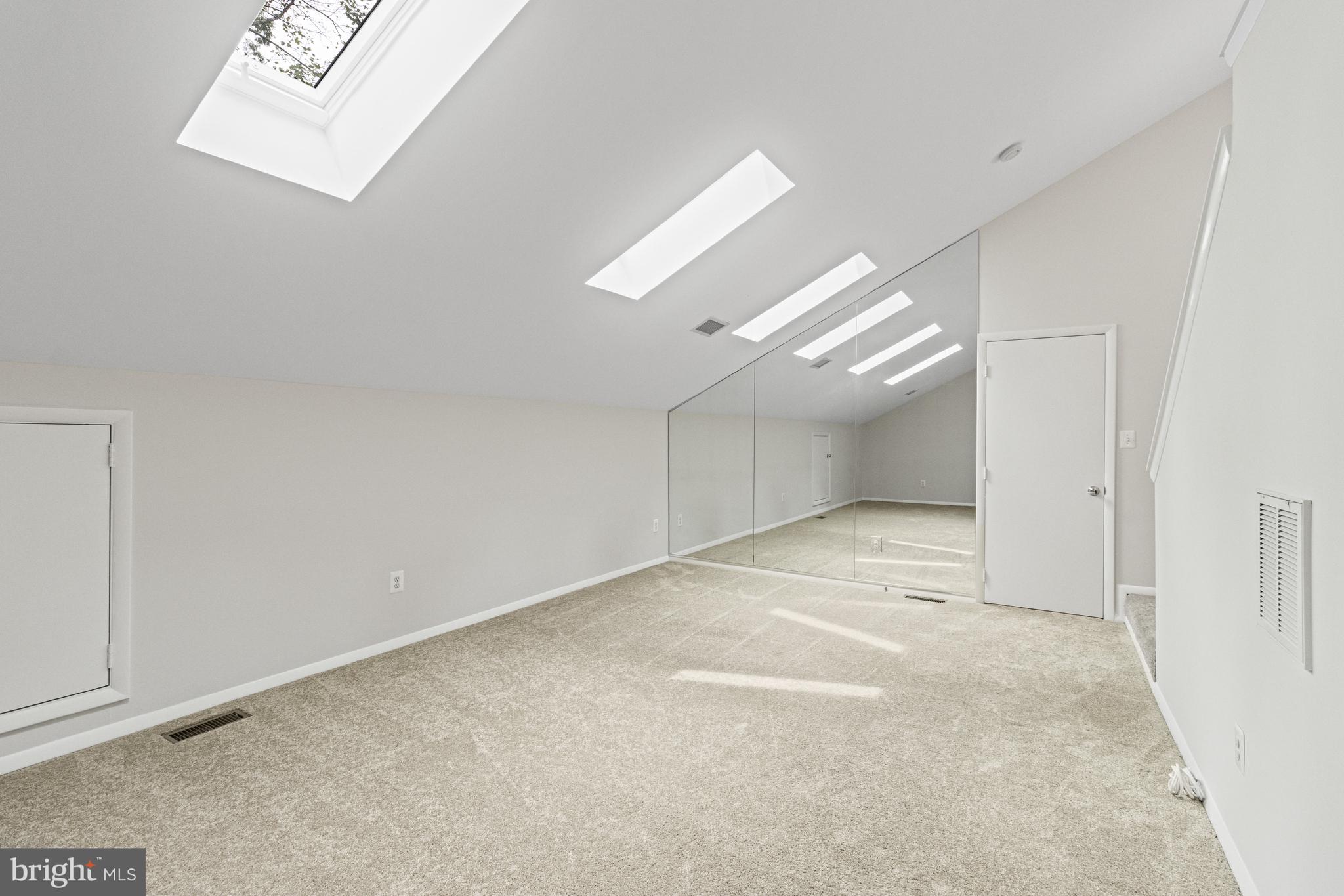 7107 Roxann Road Alexandria, VA 22315 - Photo 38 of 62 an empty room with windows and entrance