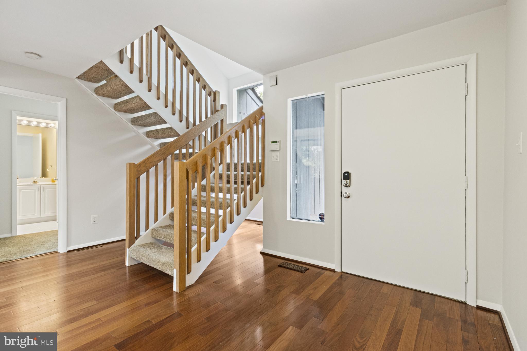 7107 Roxann Road Alexandria, VA 22315 - Photo 4 of 62 a view of an entryway with wooden floor