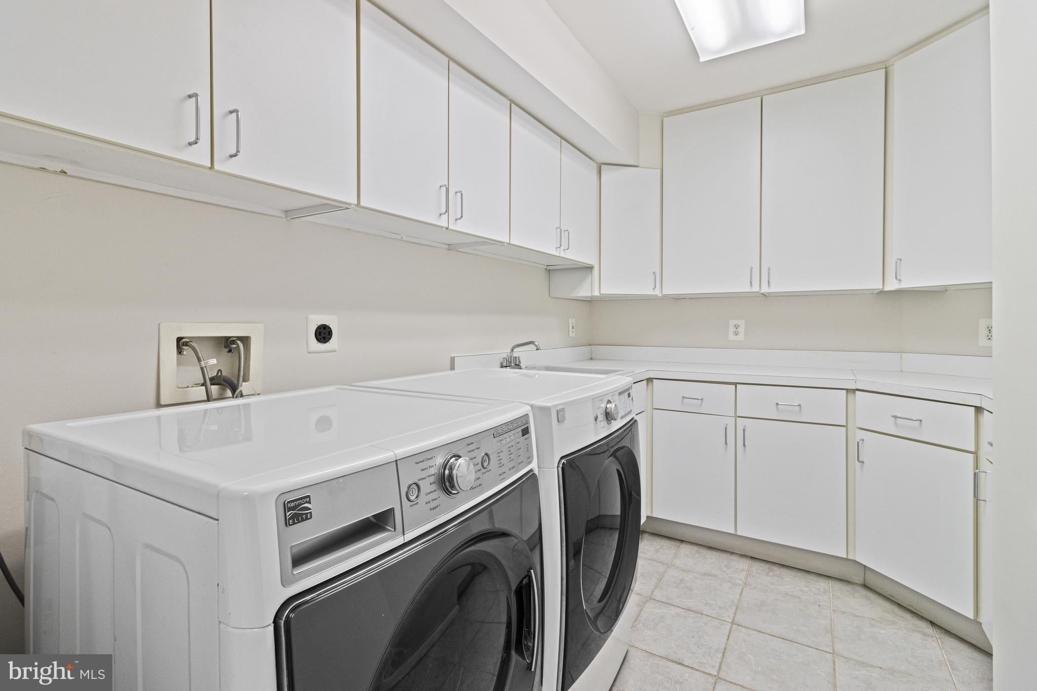 7107 Roxann Road Alexandria, VA 22315 - Photo 42 of 62 a utility room with dryer and washer