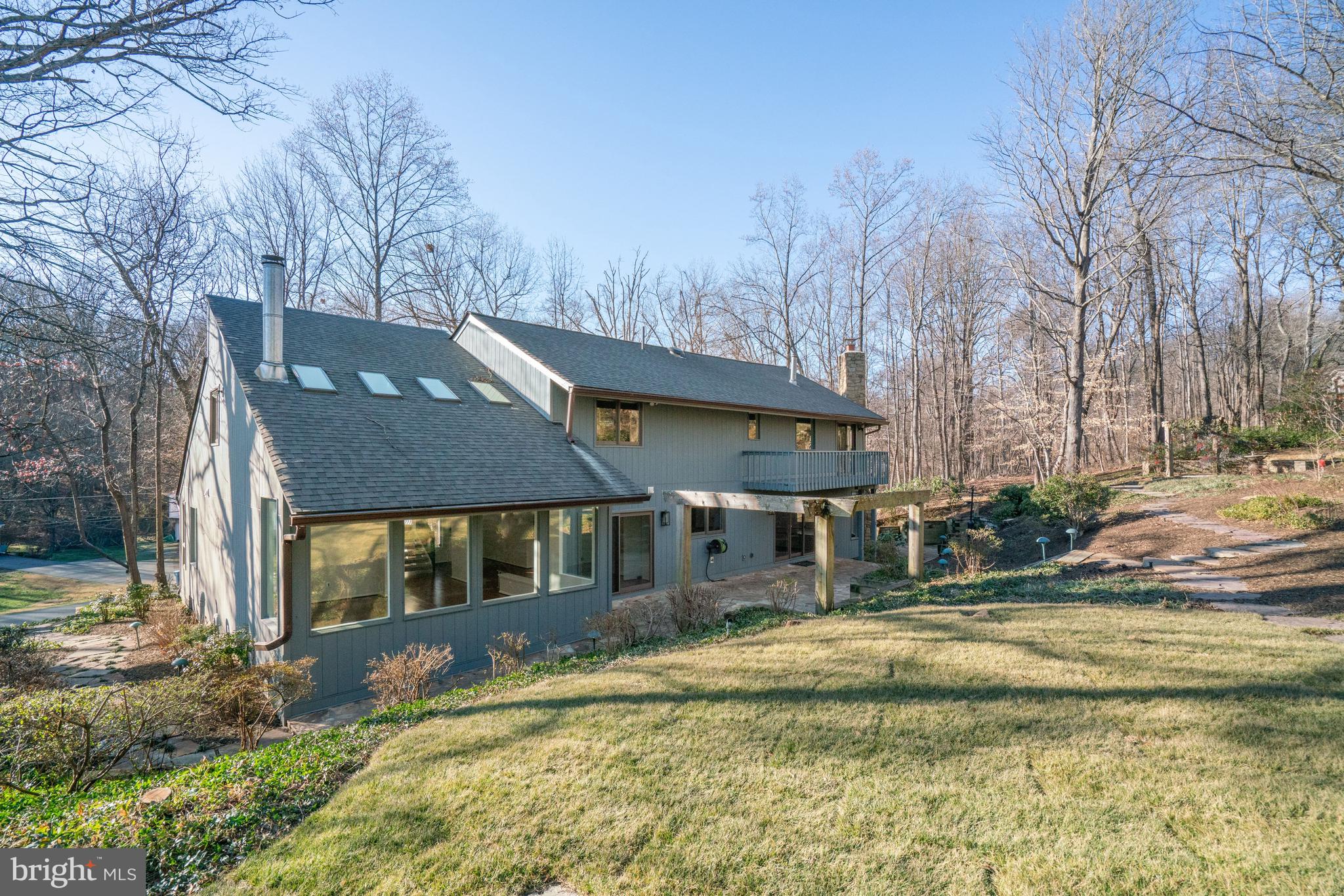 7107 Roxann Road Alexandria, VA 22315 - Photo 46 of 62 a front view of a house with a yard