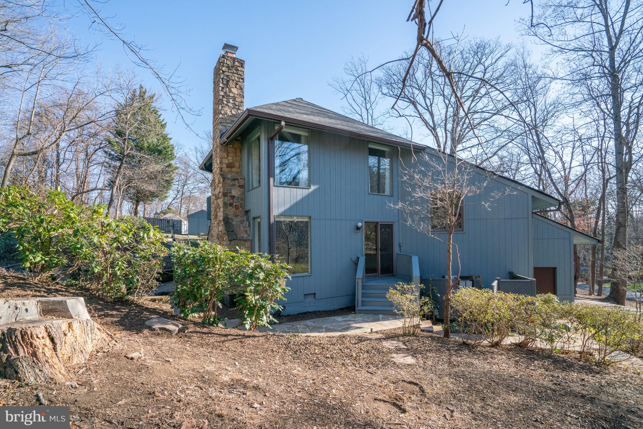7107 Roxann Road Alexandria, VA 22315 - Photo 50 of 62 a front view of a house with garden