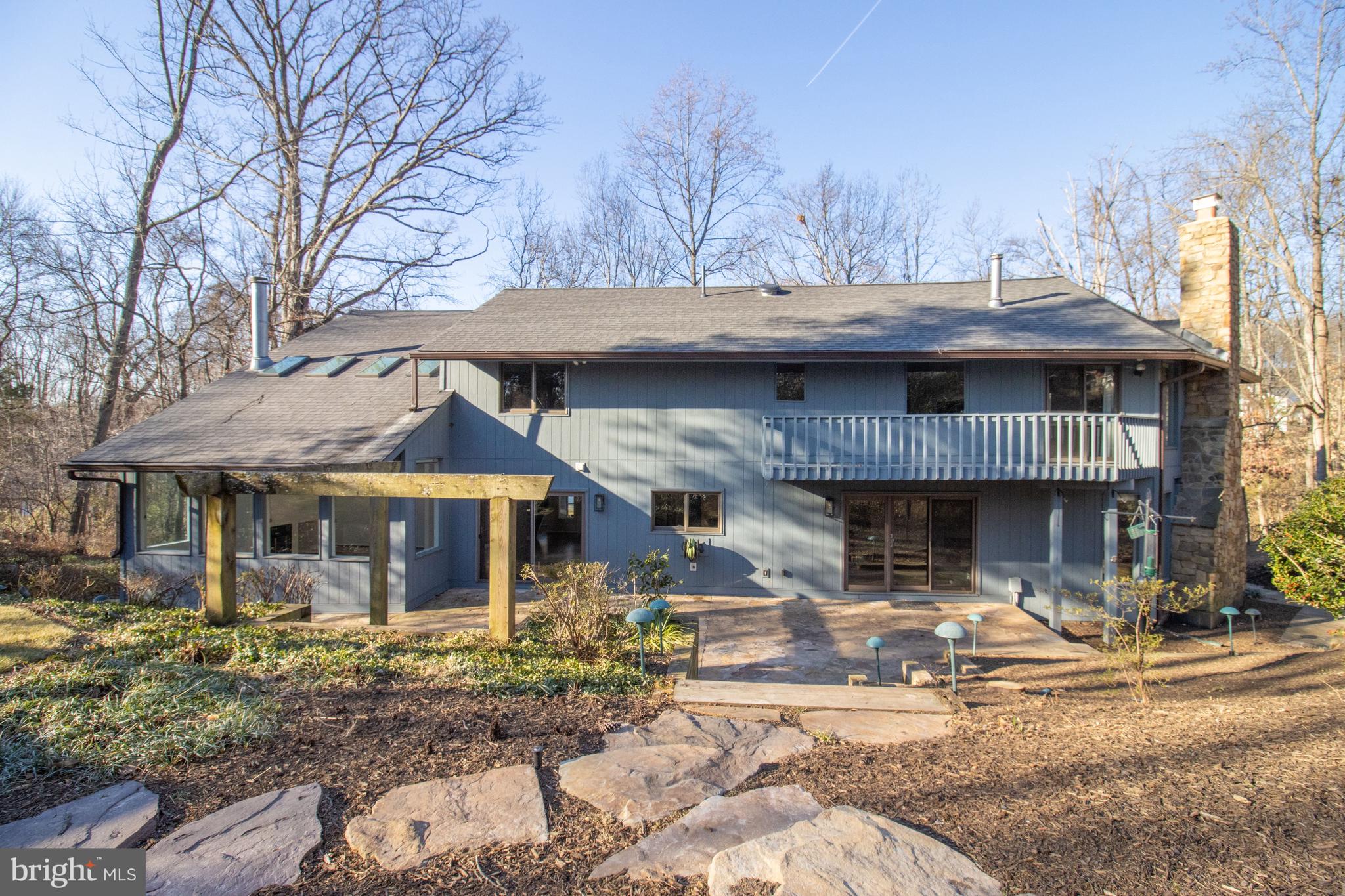 7107 Roxann Road Alexandria, VA 22315 - Photo 53 of 62 a front view of a house with garden