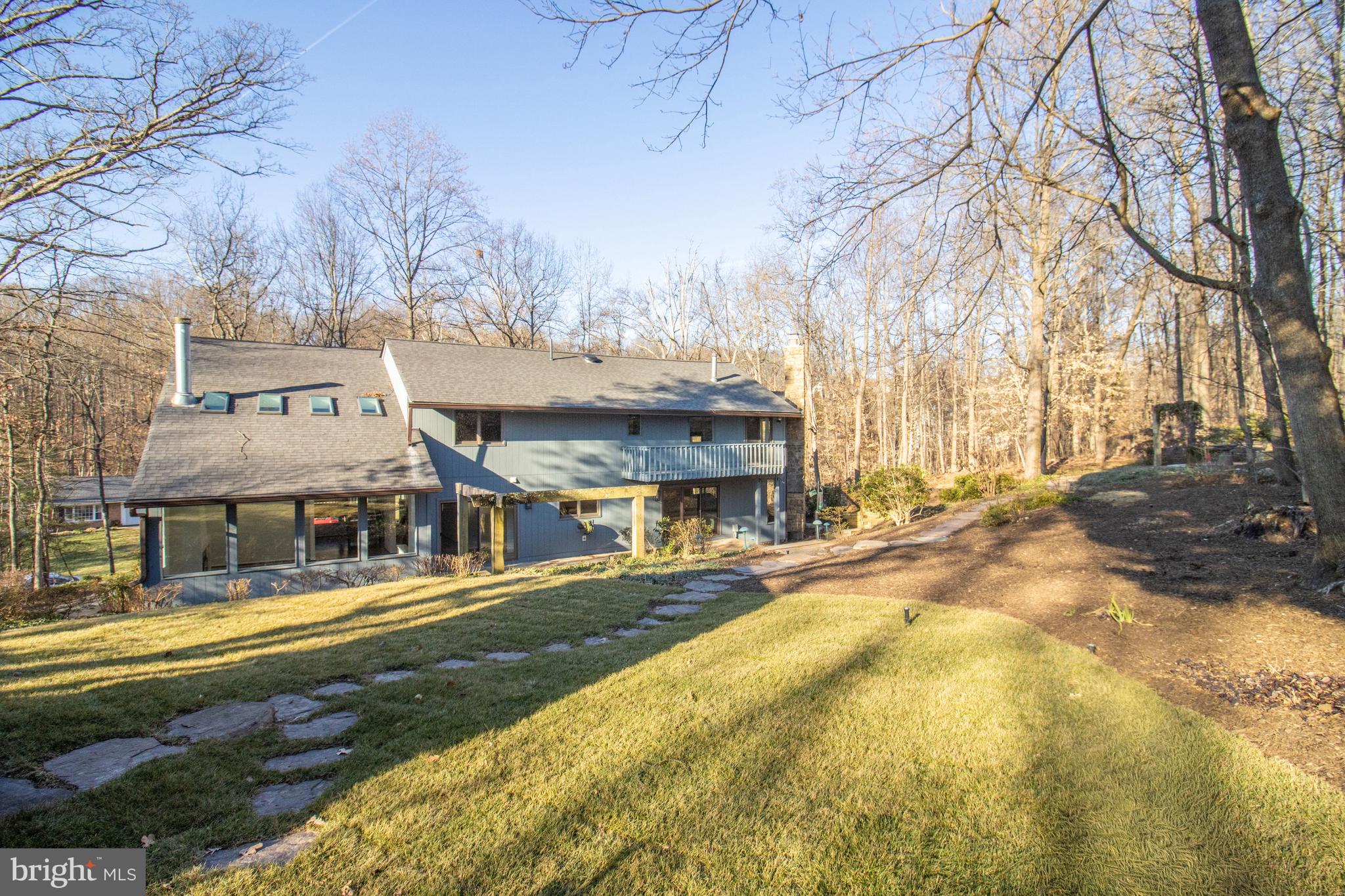 7107 Roxann Road Alexandria, VA 22315 - Photo 54 of 62 a view of a building with a yard