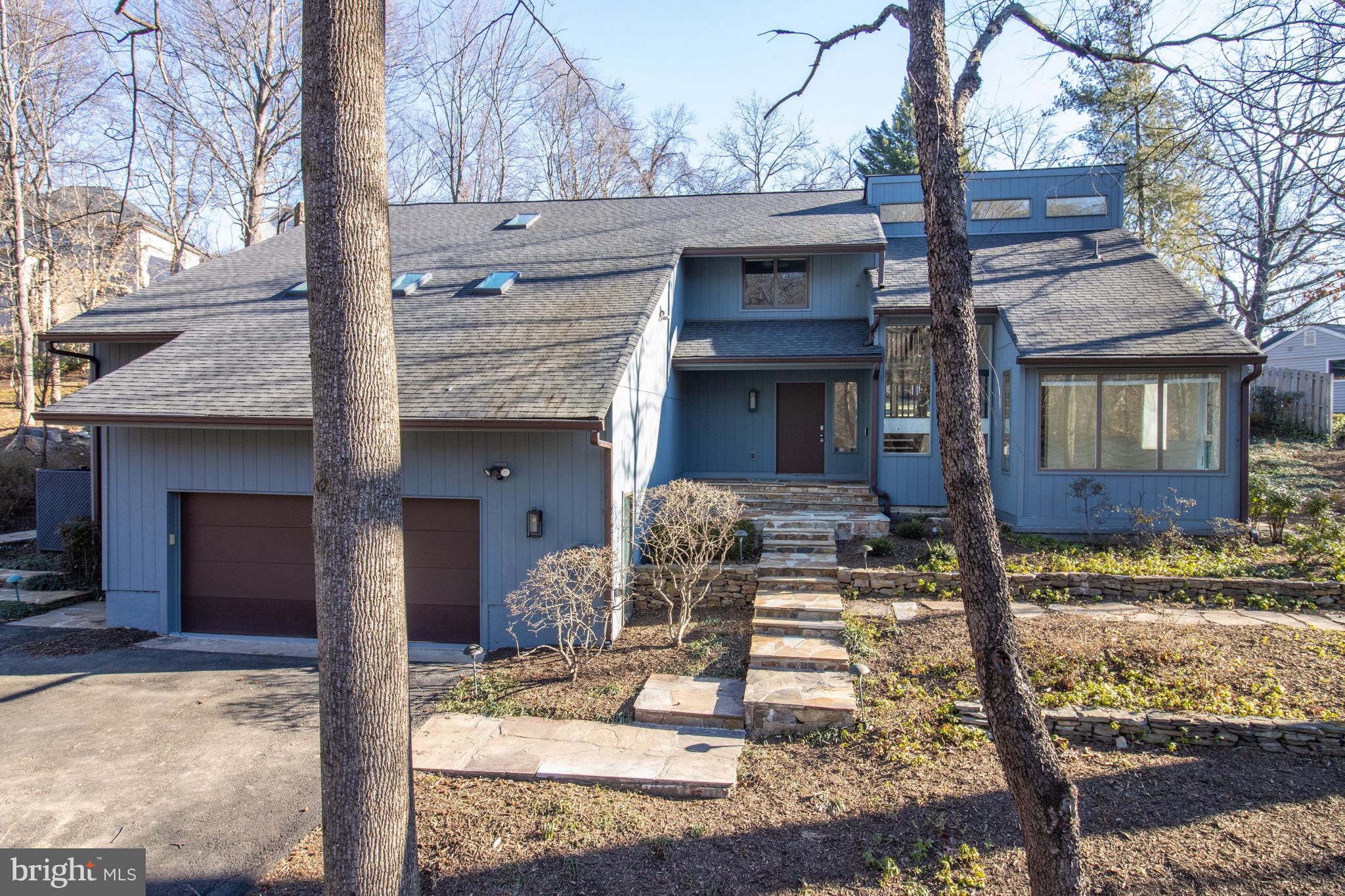 7107 Roxann Road Alexandria, VA 22315 - Photo 58 of 62 a front view of a house with garden