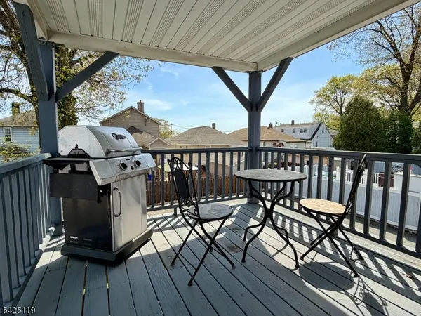 a view of a chairs and table on the deck