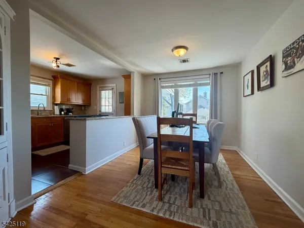 a view of a dining room with furniture and a window
