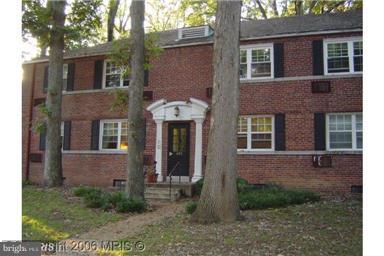 4319 2nd Road North, Unit 3 Arlington, VA 22203 - Photo 1 of 8 a view of a brick house with a yard and large tree