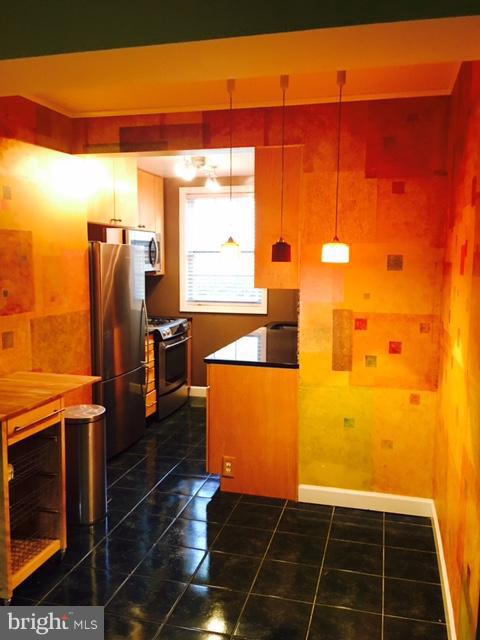 4319 2nd Road North, Unit 3 Arlington, VA 22203 - Photo 2 of 8 a view of a refrigerator with wooden floor