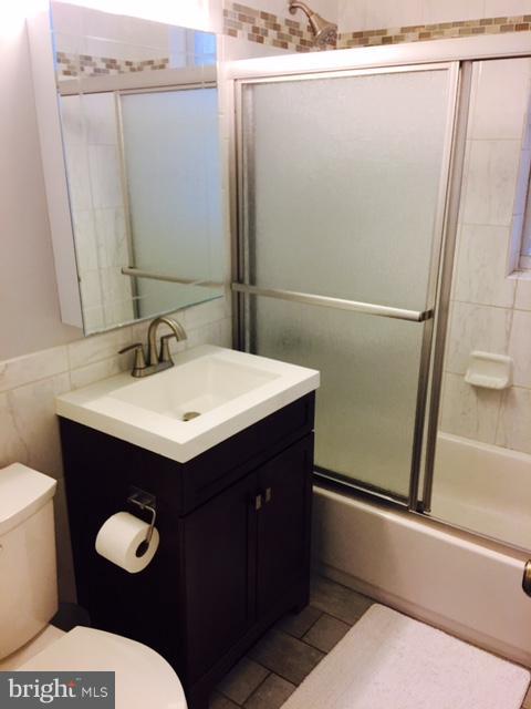 4319 2nd Road North, Unit 3 Arlington, VA 22203 - Photo 5 of 8 a bathroom with a sink and a mirror