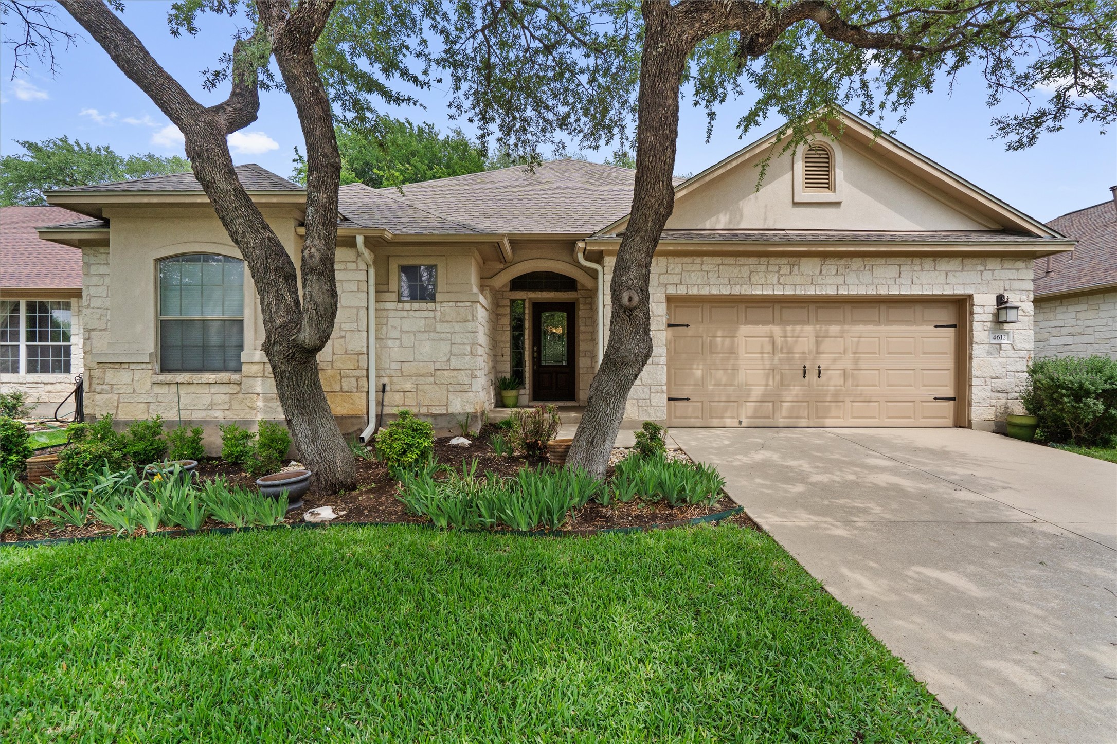 4612 Sonora Trace Georgetown, TX 78633 - Photo 8 of 36 a front view of a house with a yard and garage