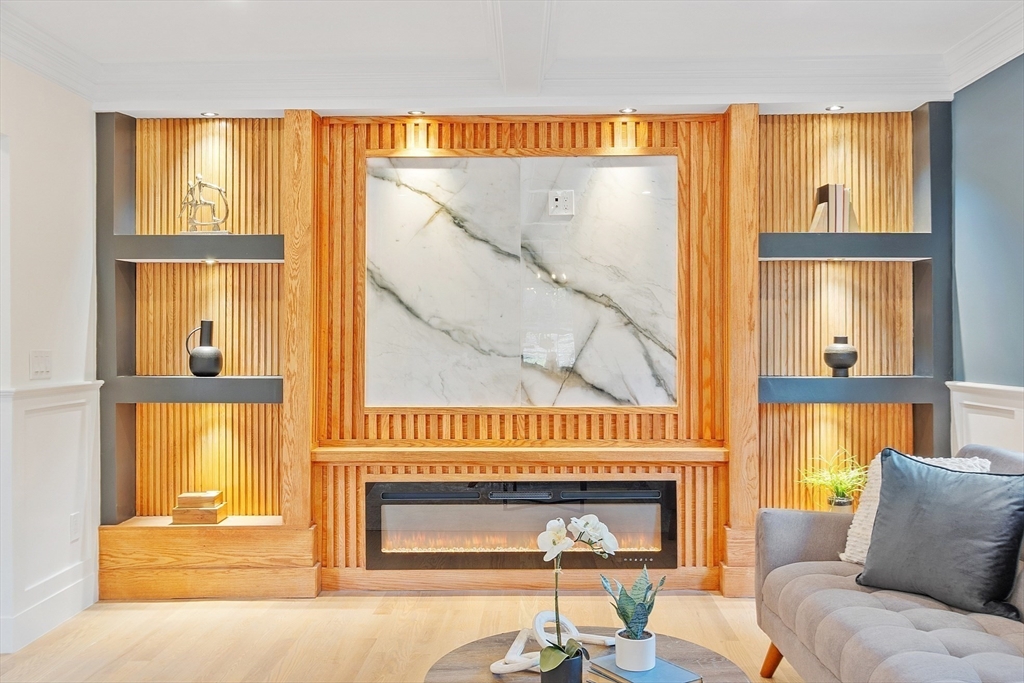 896 Main Street Reading, MA 01867 - Photo 12 of 41 a living room with furniture and a fireplace