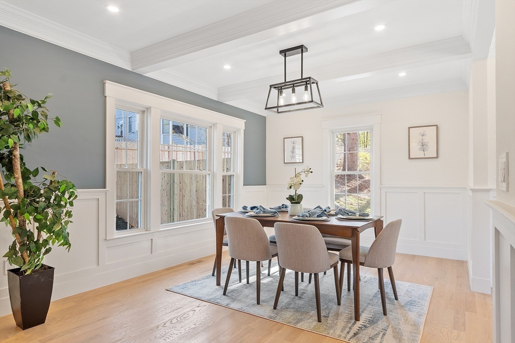 896 Main Street Reading, MA 01867 - Photo 15 of 41 a view of a dining room with furniture window and wooden floor