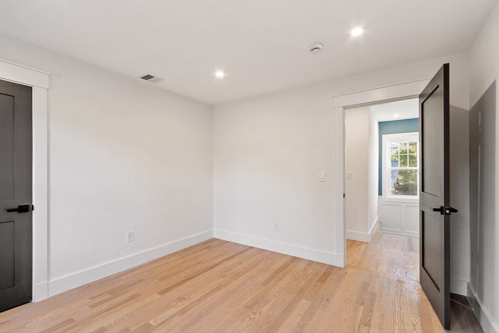 896 Main Street Reading, MA 01867 - Photo 33 of 41 wooden floor in an empty room with a window