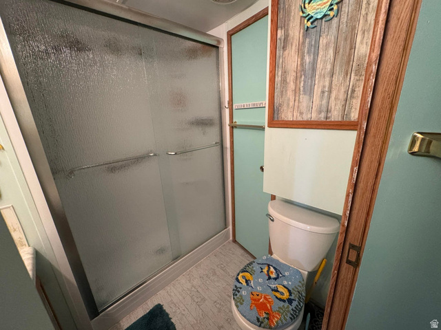 1225 North Dixie Downs Road, Unit 100 St. George, UT 84770 - Photo 14 of 22 Shower enclosure featuring frosted glass sliding doors and a metal frame