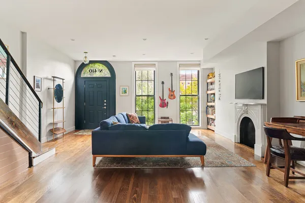 a living room with furniture and a fireplace