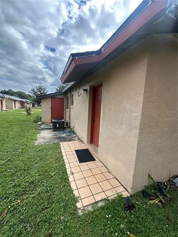 a view of a backyard of the house
