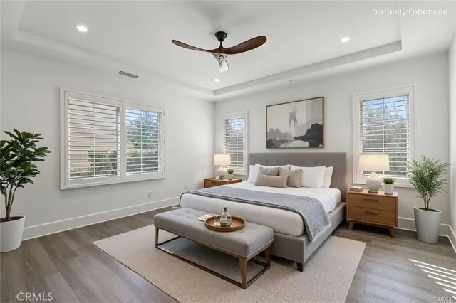 a bedroom with a bed and a couch