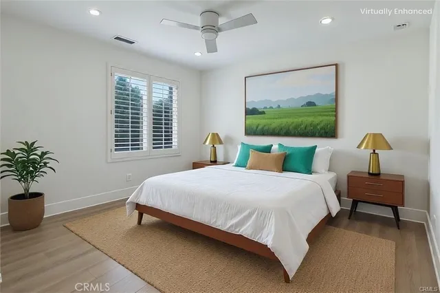 a bedroom with bed and window