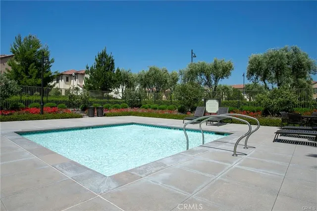 a view of a swimming pool with a lounge chair