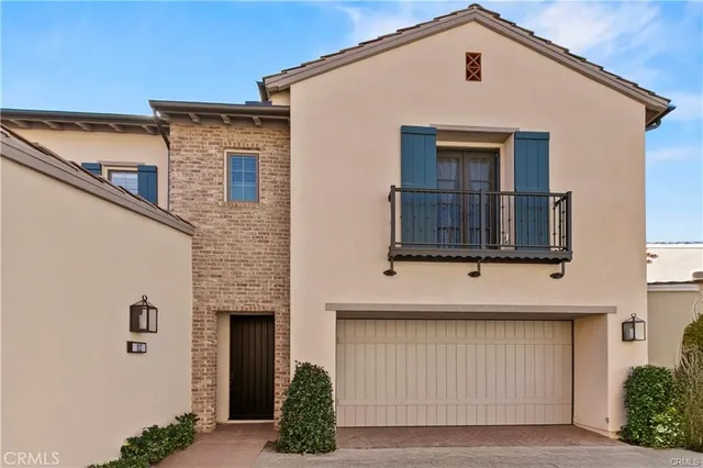 a front view of a house with garage