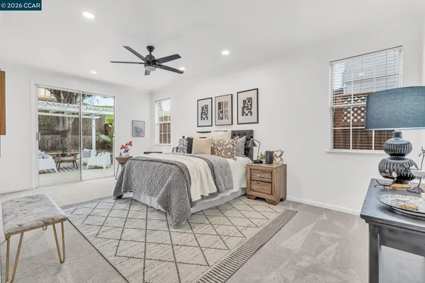 a bedroom with a bed furniture and window