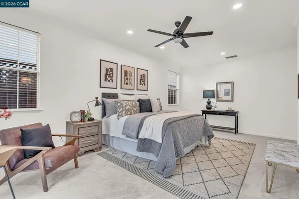 a bed room with a bed and a television