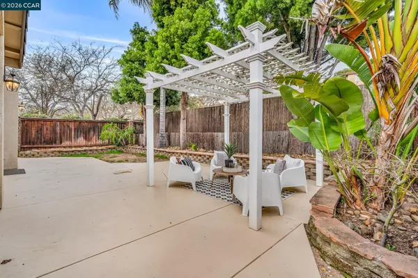 an aerial view of residential houses with outdoor space and river