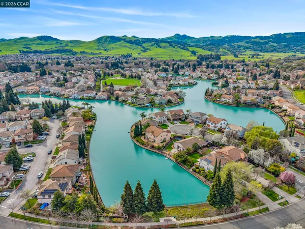 an aerial view of a house with a lake view