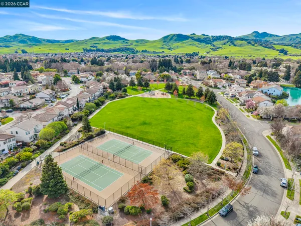 a view of a swimming pool with a yard