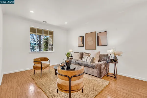 a view of a dining room with furniture window and wooden floor