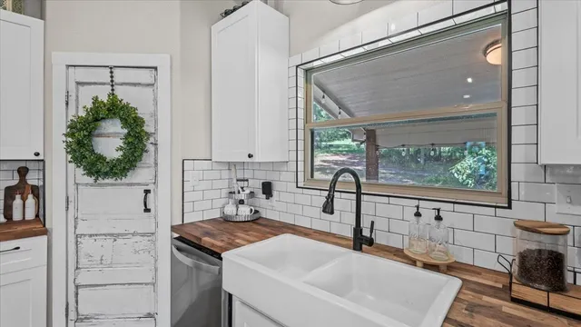 a kitchen with a sink and a refrigerator