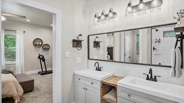 a bathroom with a sink and a mirror