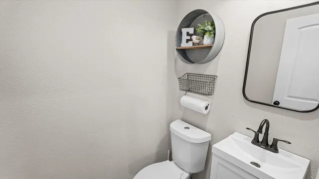 a bathroom with a toilet and a sink