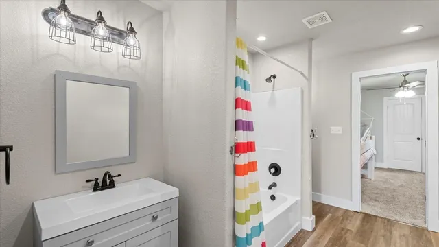 a bathroom with a bathtub and a shower