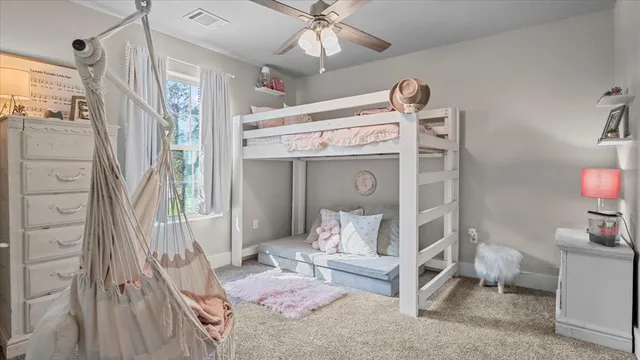 a bedroom with a bed and a view of bathroom