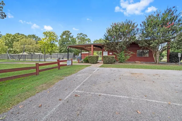 a view of a lake with houses in the back