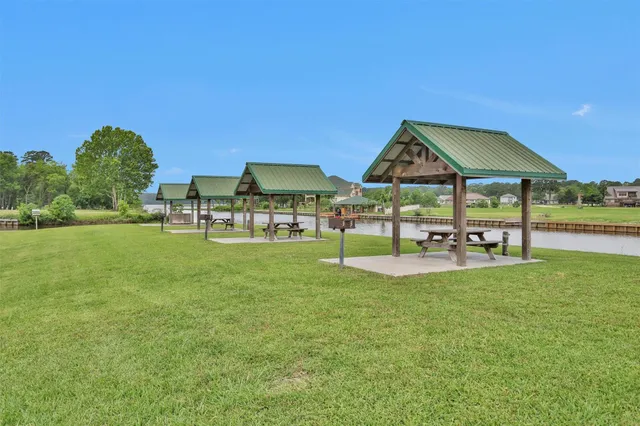 a view of a swimming pool with lounge chairs