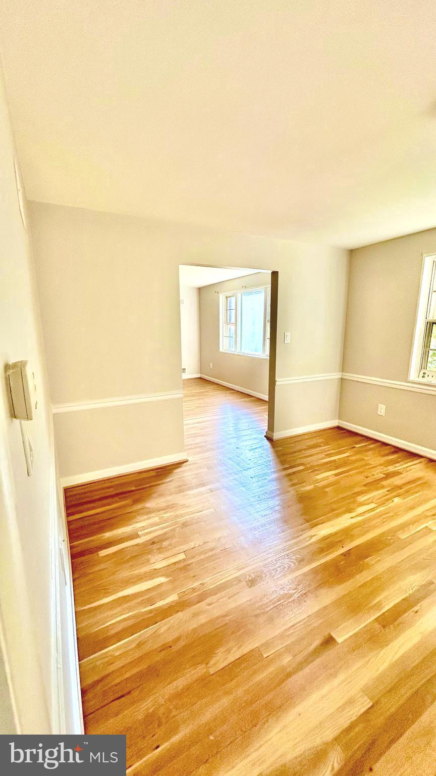 5319 Pooks Hill Road, Unit 1 Bethesda, MD 20814 - Photo 5 of 37 a view of empty room with wooden floor
