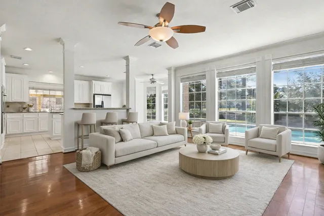 a living room with furniture fireplace and a flat screen tv