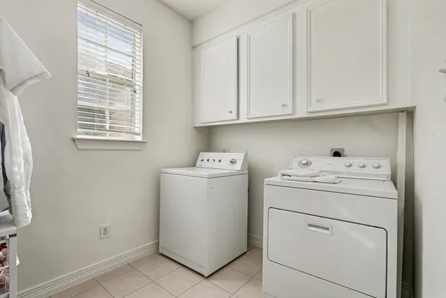 a spacious bedroom with a bed and a couch